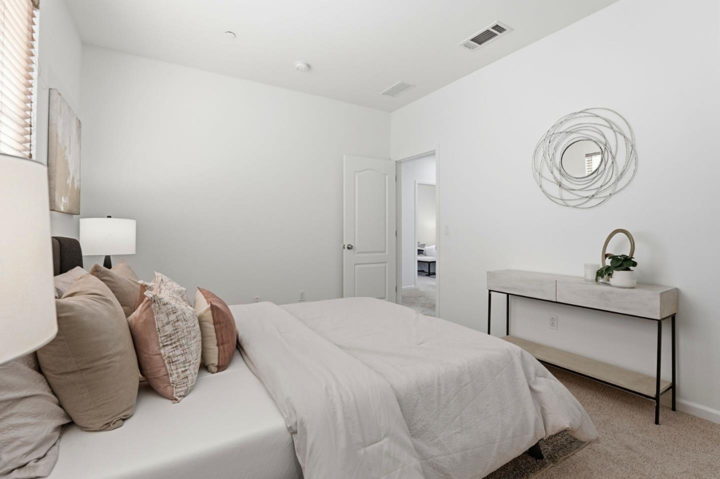 170 Sturla Way Gilroy, CA 95020 - Photo 30 of 64 a bedroom with a bed and a lamp on dresser
