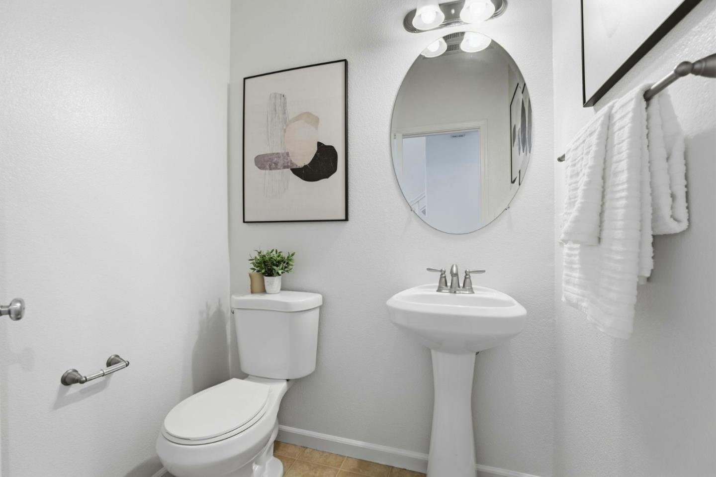 170 Sturla Way Gilroy, CA 95020 - Photo 35 of 64 a bathroom with a toilet sink and mirror