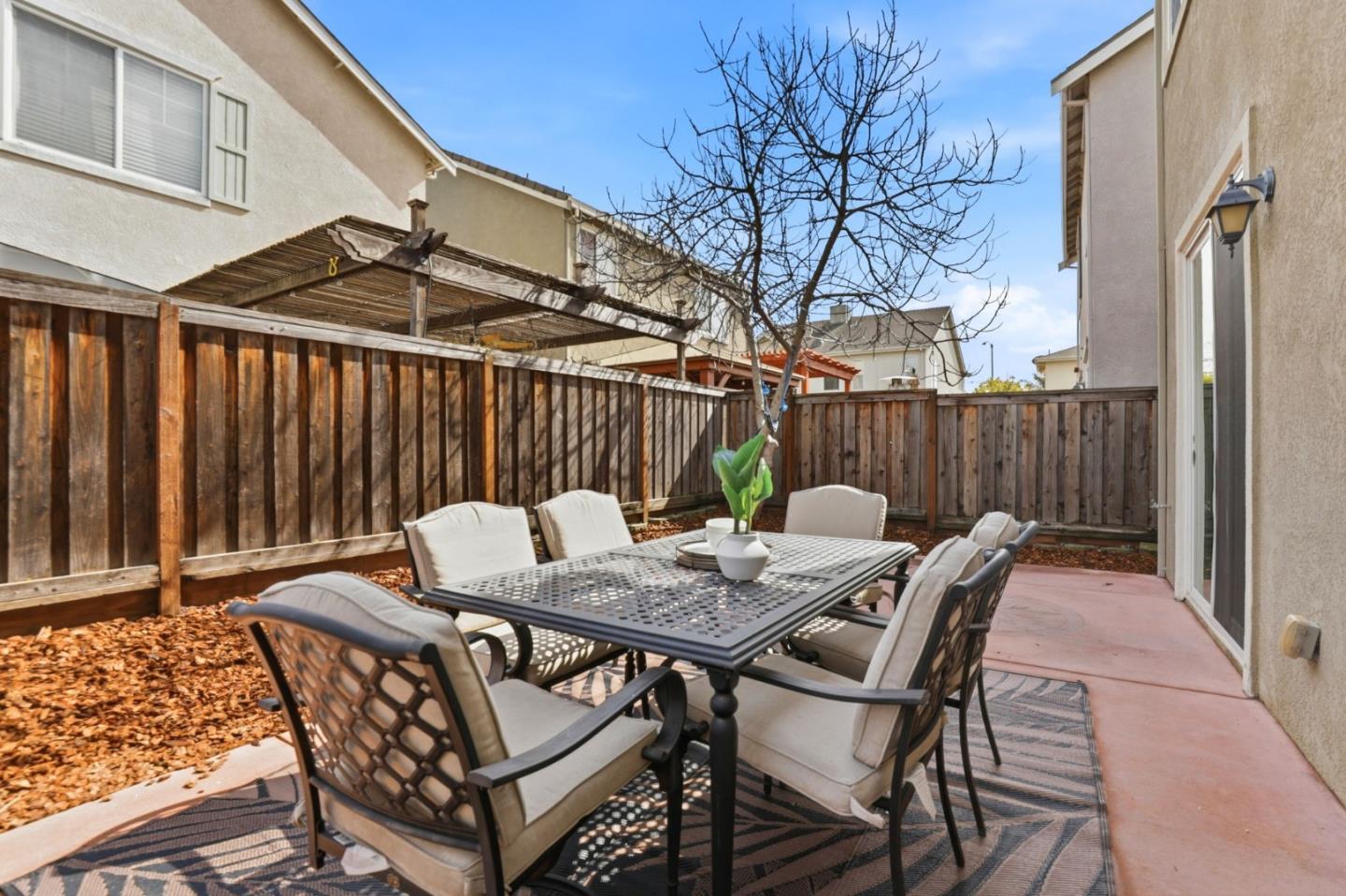170 Sturla Way Gilroy, CA 95020 - Photo 40 of 64 a view of a patio with a table and chairs