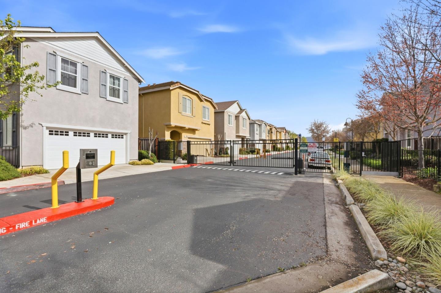 170 Sturla Way Gilroy, CA 95020 - Photo 44 of 64 a city street lined with buildings and trees
