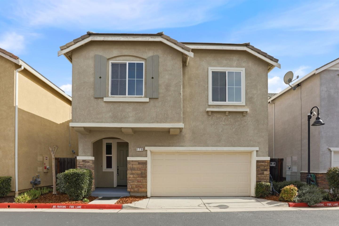 170 Sturla Way Gilroy, CA 95020 - Photo 5 of 64 a front view of a house with a yard