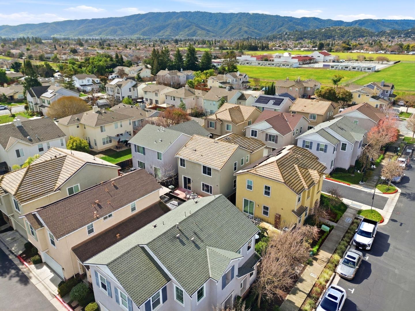 170 Sturla Way Gilroy, CA 95020 - Photo 60 of 64 an aerial view of a city with lots of residential buildings and mountain view in back