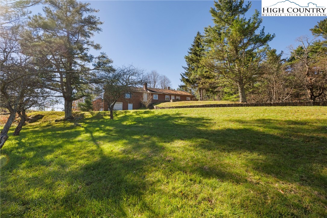 986 Ransom Street Blowing Rock, NC 28605 - Photo 15 of 17 a swimming pool with an outdoor space and seating area