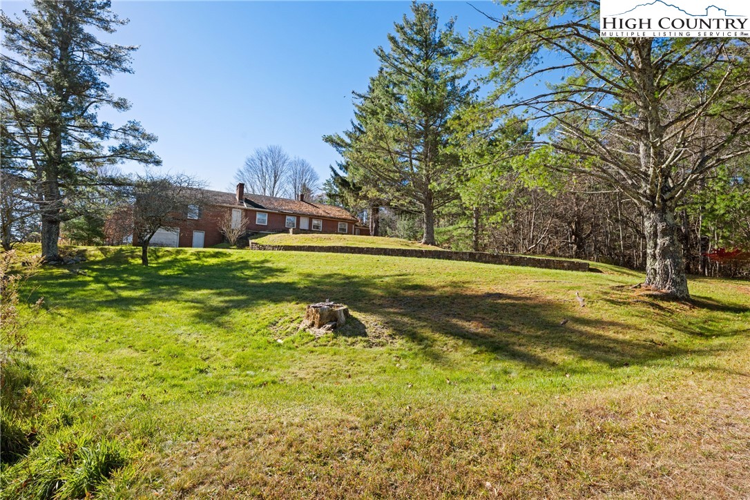 986 Ransom Street Blowing Rock, NC 28605 - Photo 16 of 17 a view of a trees in front of a building