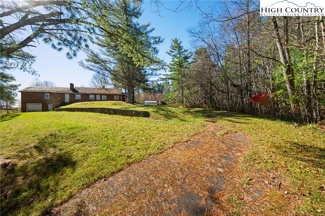 986 Ransom Street Blowing Rock, NC 28605 - Photo 6 of 17 a view of a swimming pool with an outdoor space