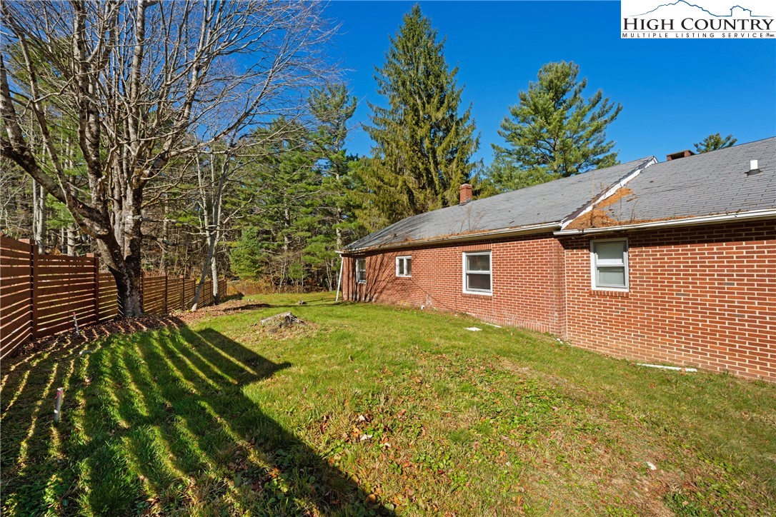 986 Ransom Street Blowing Rock, NC 28605 - Photo 10 of 17 a view of a backyard with large trees