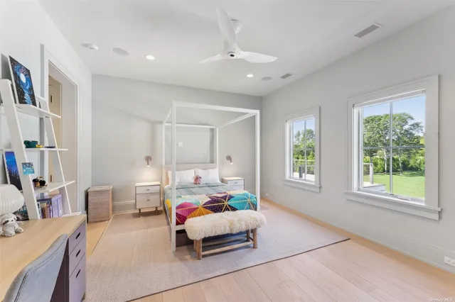 a bedroom with furniture and a window