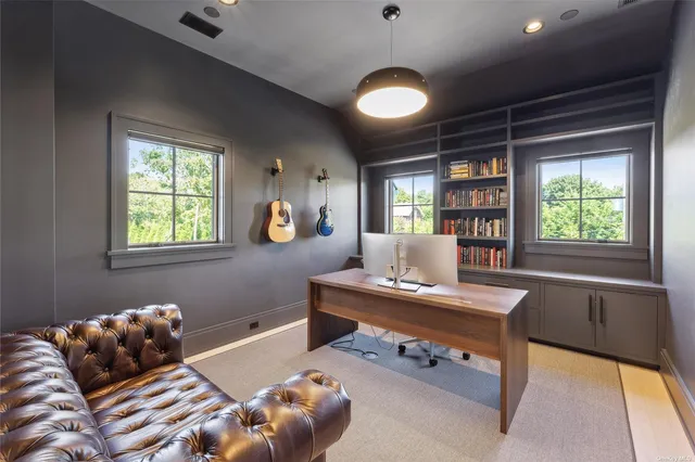 a bedroom with furniture and a window