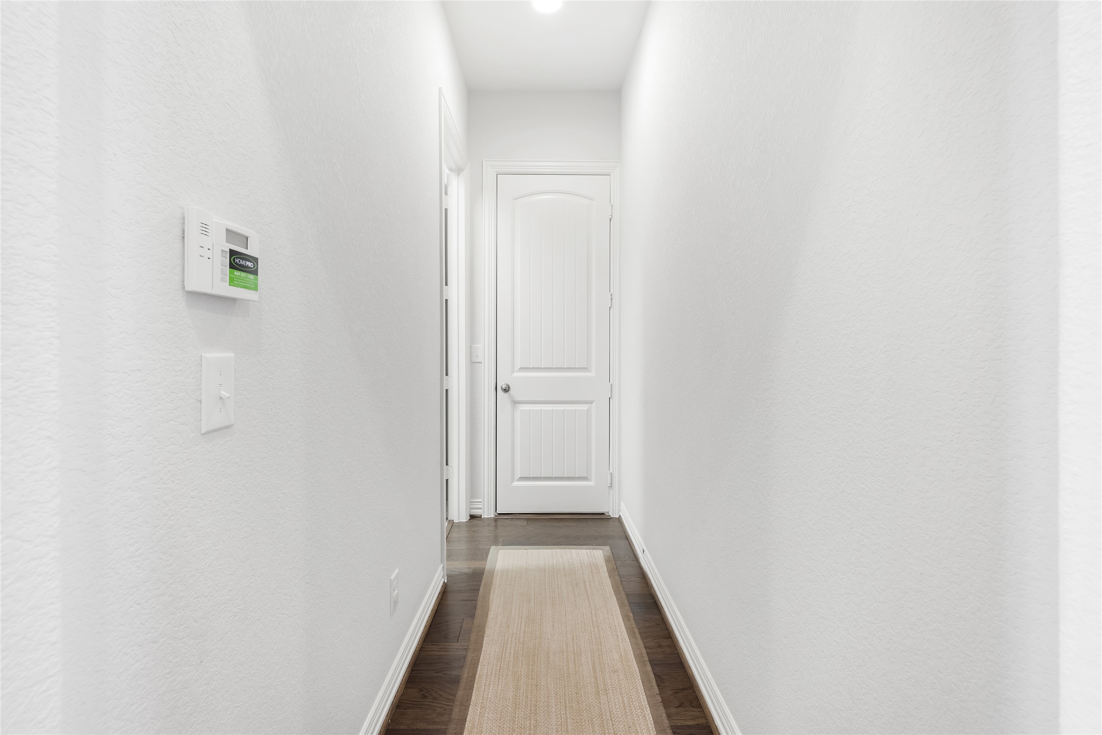 19901 Isle Of Glass Street Pflugerville, TX 78660 - Photo 14 of 40 a view of a hallway with wooden floor
