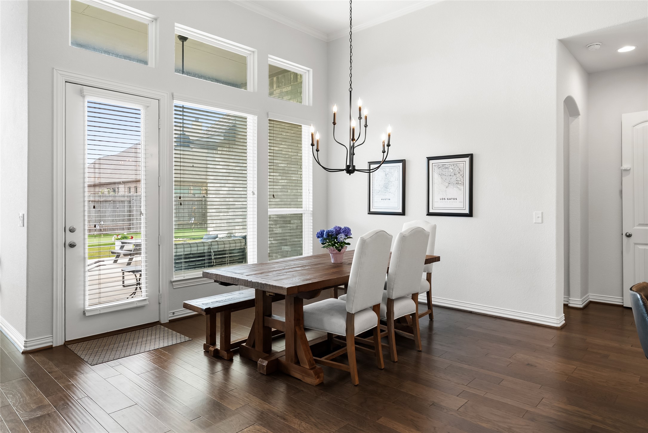 19901 Isle Of Glass Street Pflugerville, TX 78660 - Photo 15 of 40 a view of a dining room with furniture window and wooden floor