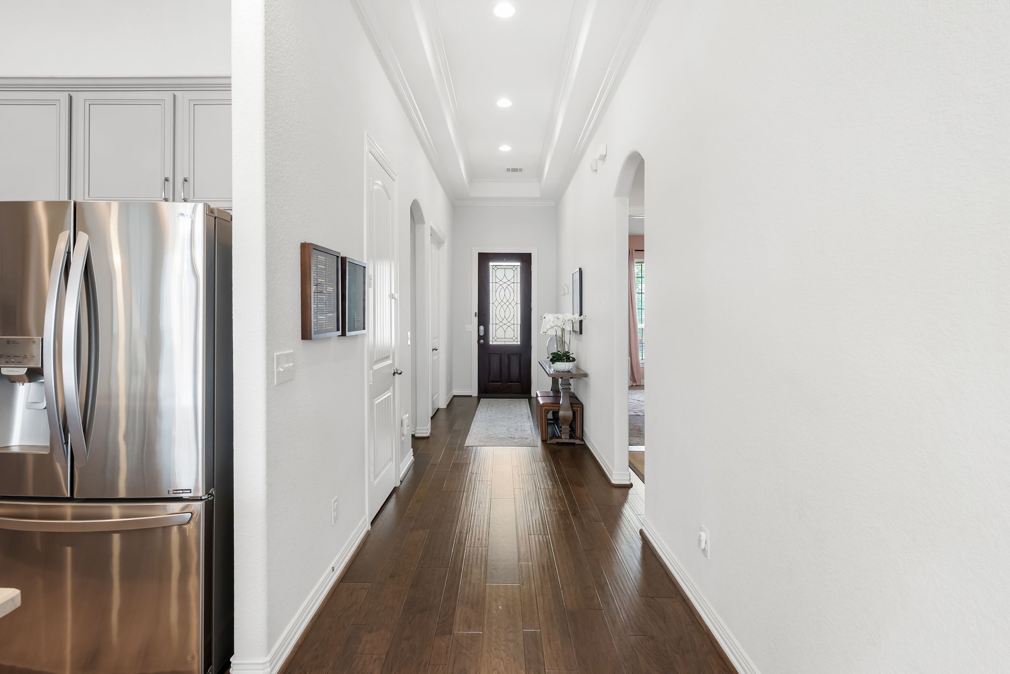 19901 Isle Of Glass Street Pflugerville, TX 78660 - Photo 25 of 40 a view of a hallway with wooden floor