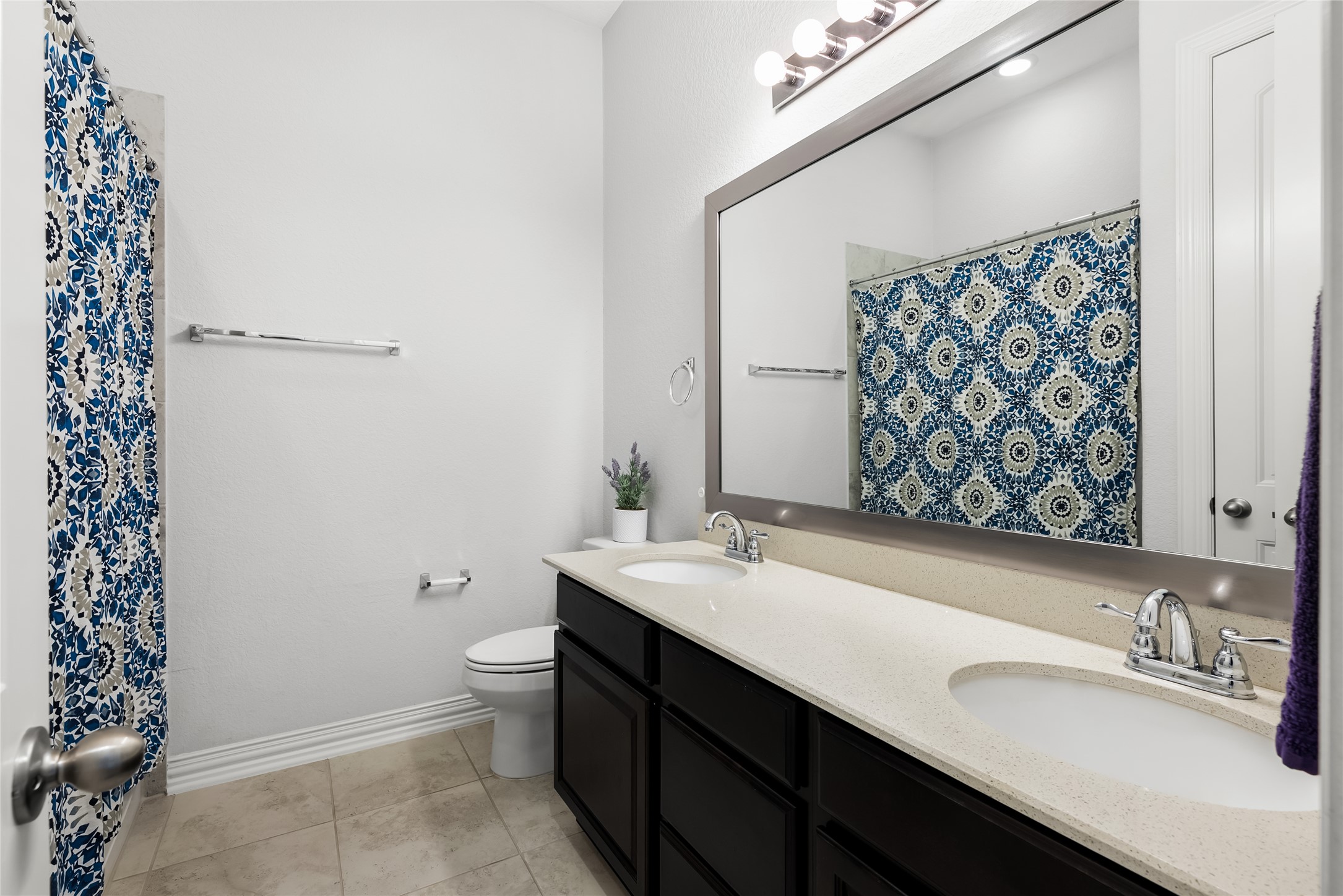 19901 Isle Of Glass Street Pflugerville, TX 78660 - Photo 8 of 40 a bathroom with a sink a toilet and shower