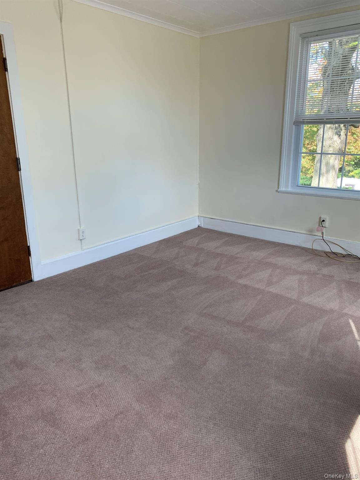 198 Flax Hill Road Norwalk, CT 06854 - Photo 5 of 12 a view of an empty room with a window