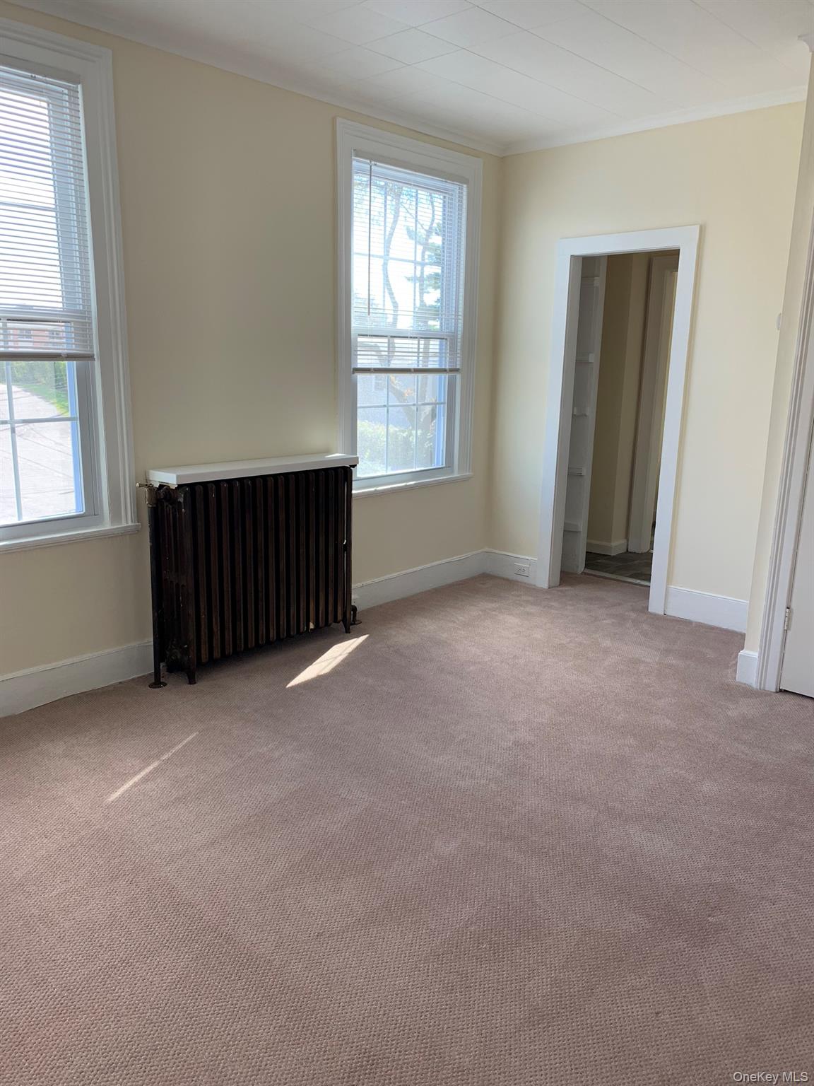 198 Flax Hill Road Norwalk, CT 06854 - Photo 6 of 12 an empty room with windows and closet