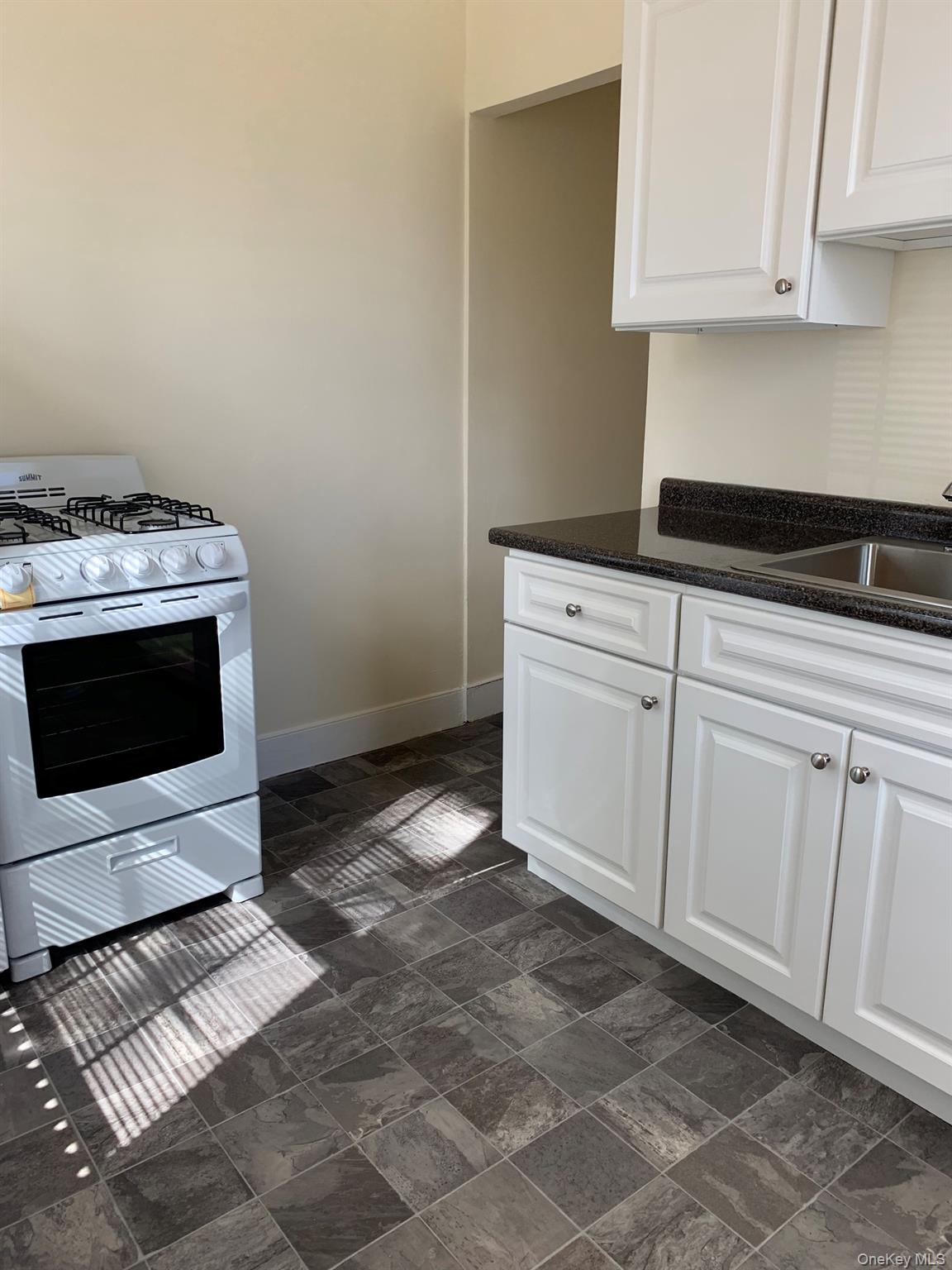 198 Flax Hill Road Norwalk, CT 06854 - Photo 9 of 12 a stove top oven sitting inside of a kitchen