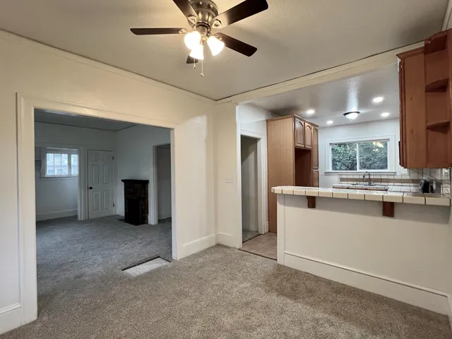 a view of a kitchen with a sink and cabinet area