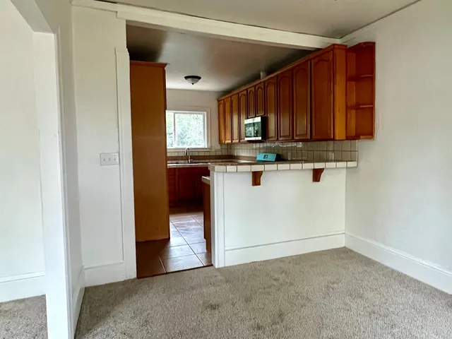 a view of kitchen with wooden floor