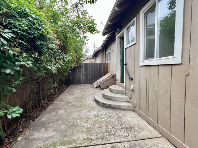 a view of a back yard of the house