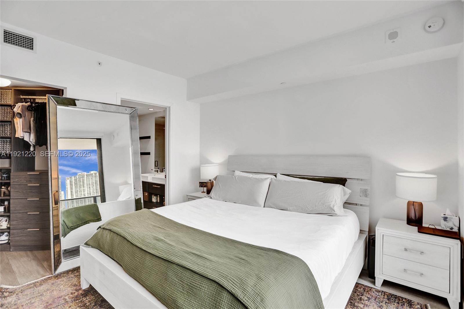 45 Southwest 9th Street, Unit 2001 Miami, FL 33130 - Photo 12 of 48 a bedroom with a bed and a night stand