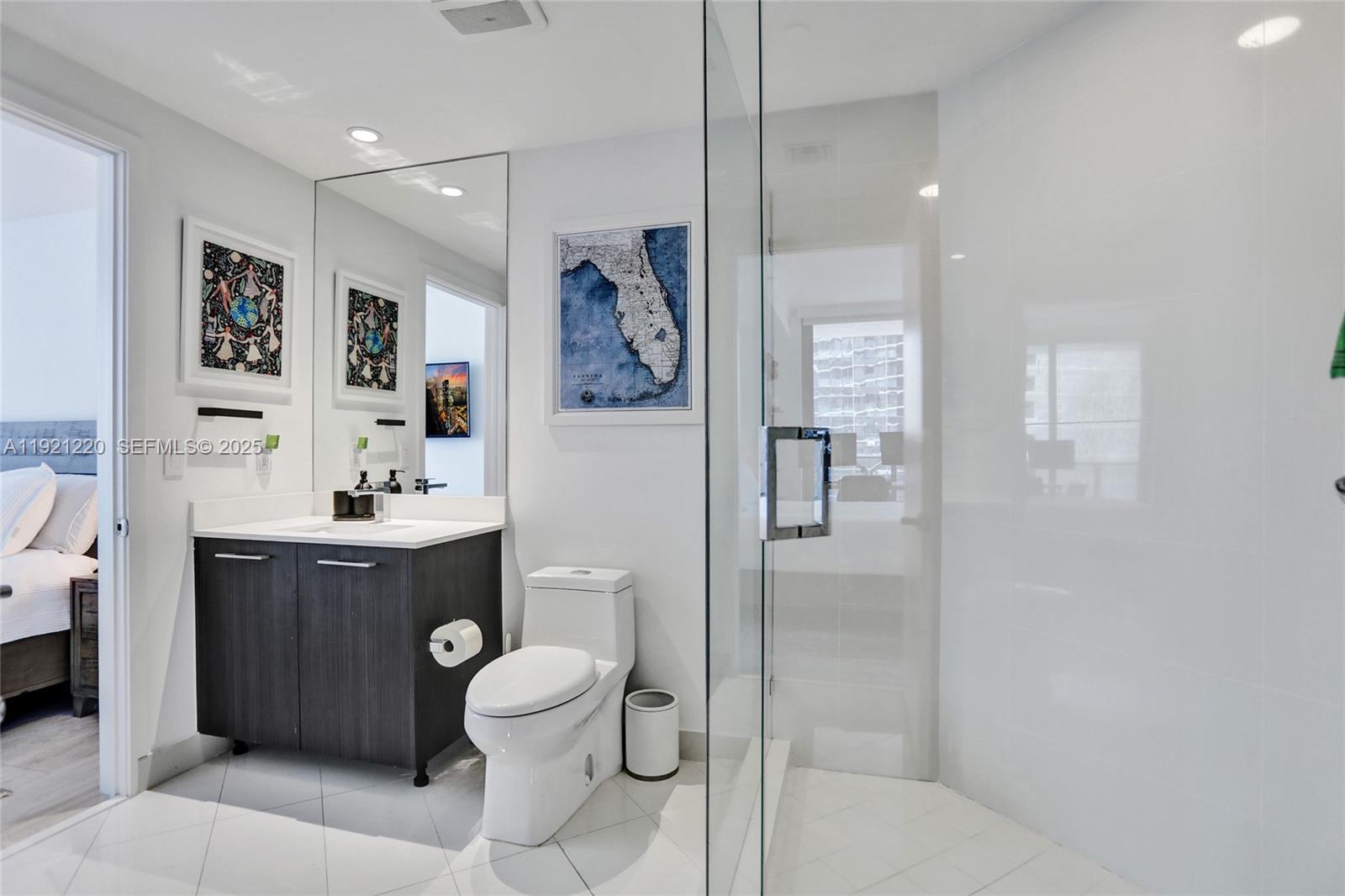 45 Southwest 9th Street, Unit 2001 Miami, FL 33130 - Photo 18 of 48 a bathroom with a sink toilet tub and shower