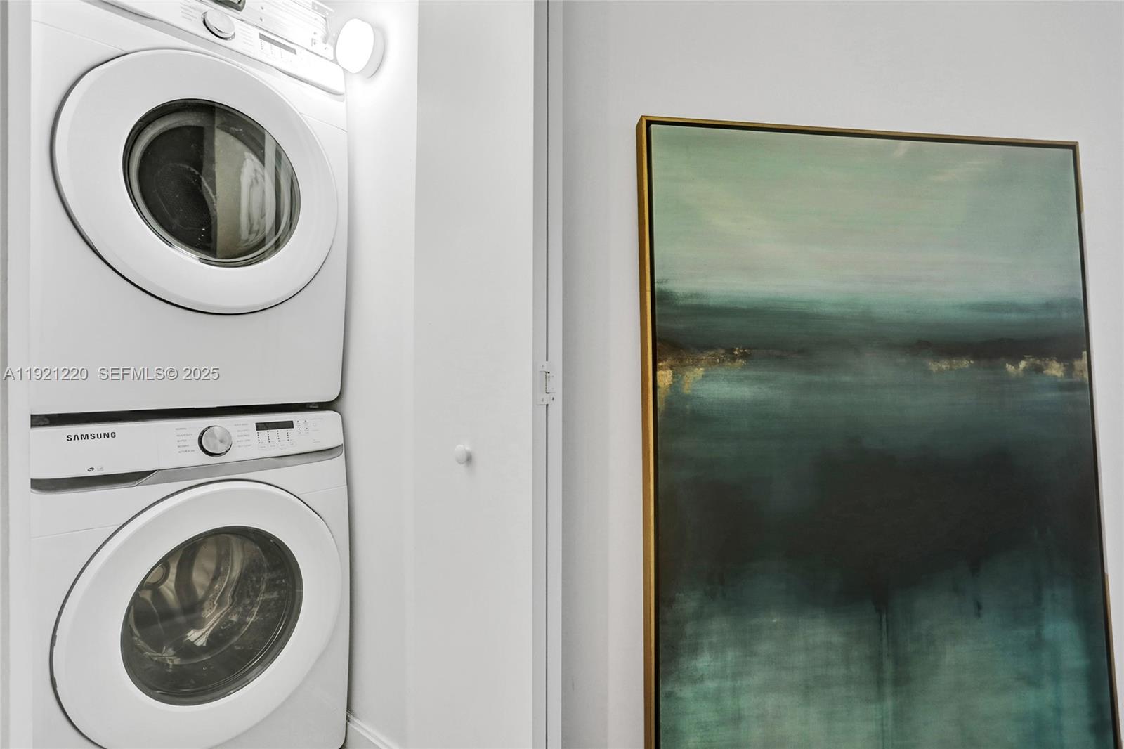 45 Southwest 9th Street, Unit 2001 Miami, FL 33130 - Photo 29 of 48 a close view of a bathroom with a washer and dryer