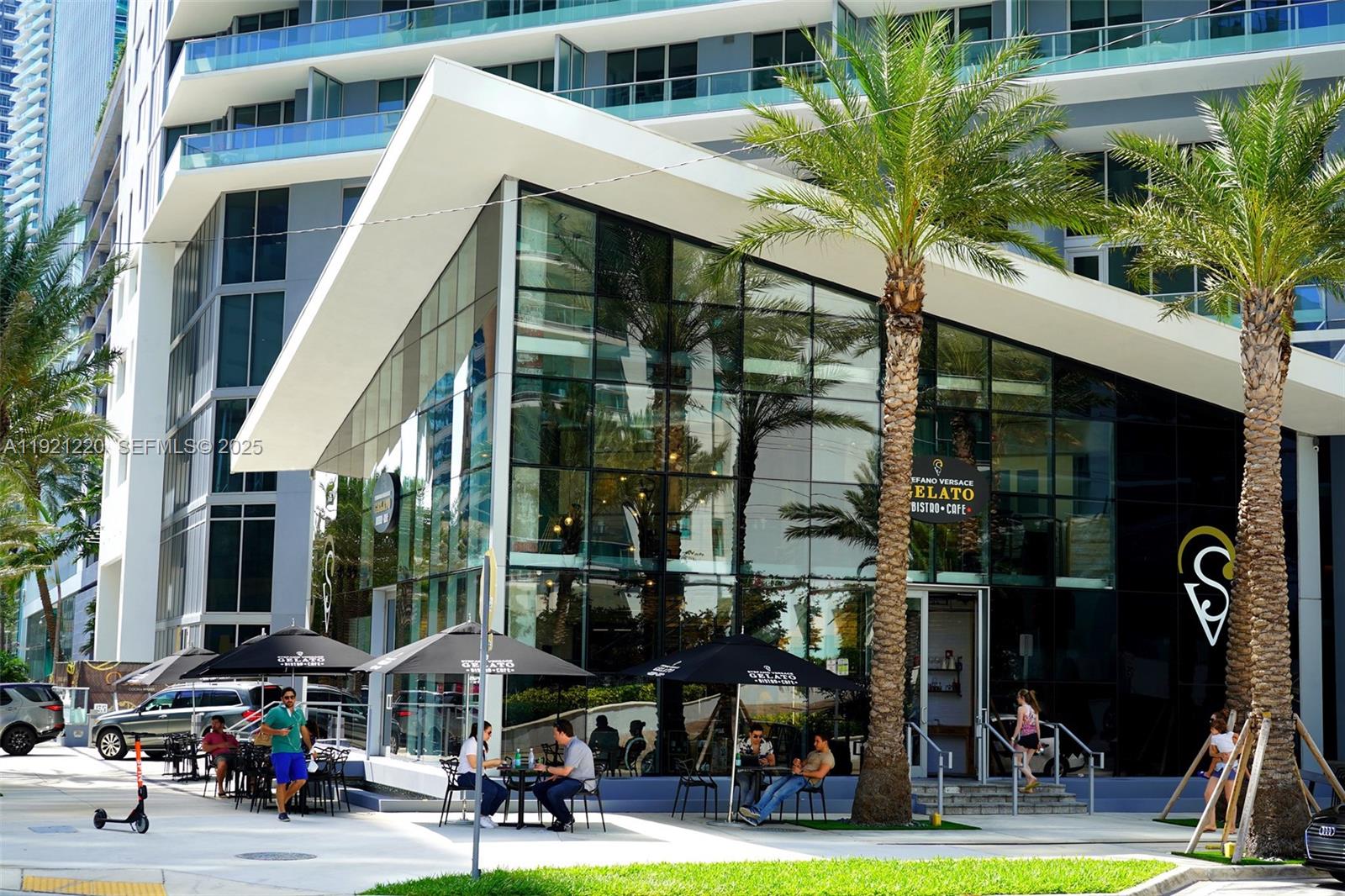 45 Southwest 9th Street, Unit 2001 Miami, FL 33130 - Photo 48 of 48 a view of a building with a yard and a car park in front of it