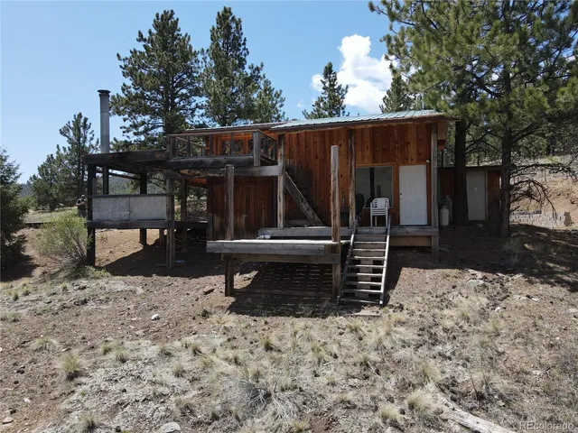 a view of a chairs and table in the patio