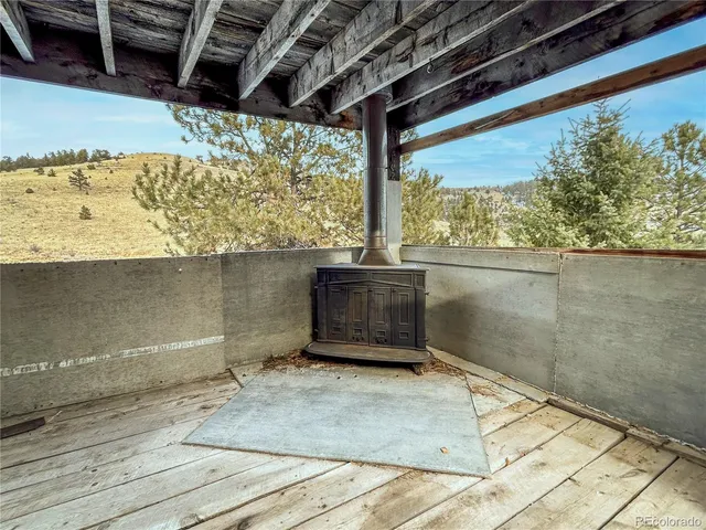 a view of a forest with mountains in the background