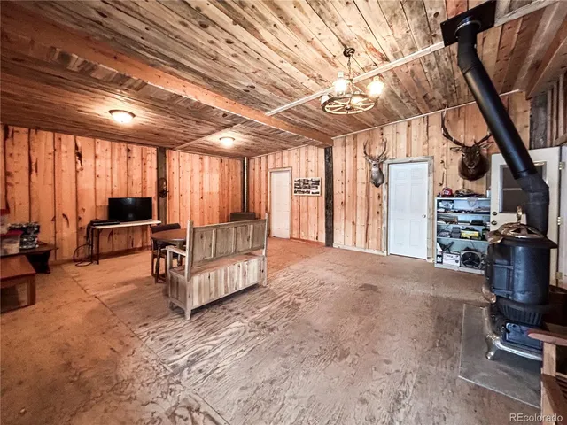 a living room with furniture a flat screen tv and a large window