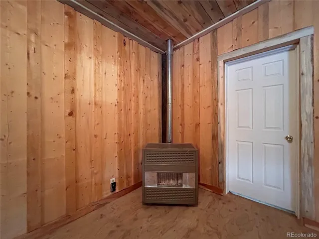 a view of an empty room with fire place