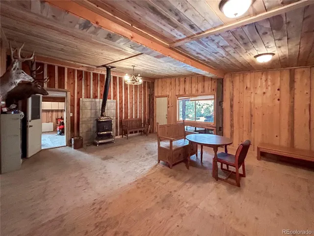 a view of a livingroom with furniture and a window