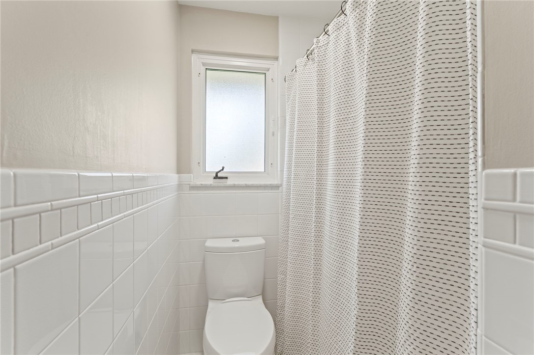 2247 East Whipp Road Dayton, OH 45440 - Photo 29 of 52 This bright bathroom features a privacy window, providing natural light above the toilet.