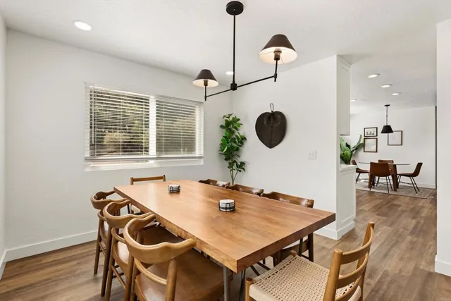 a kitchen with sink cabinets and wooden floor