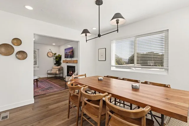 a view of a workspace area with furniture and a potted plant