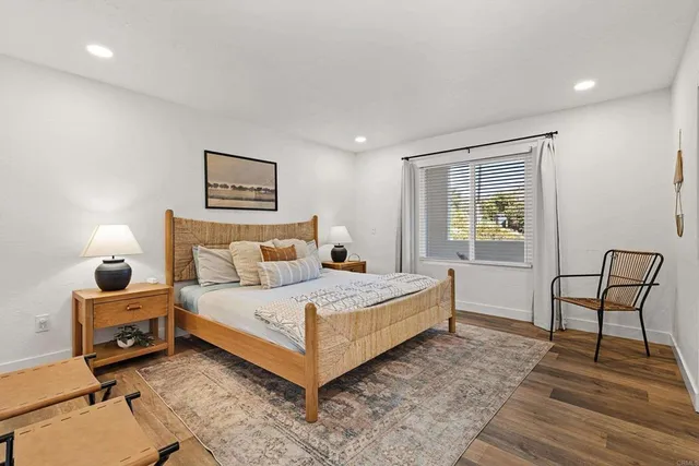 a room with furniture pool table table tennis table and a flat screen tv