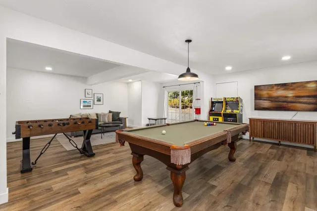 a bedroom with bed and a chair