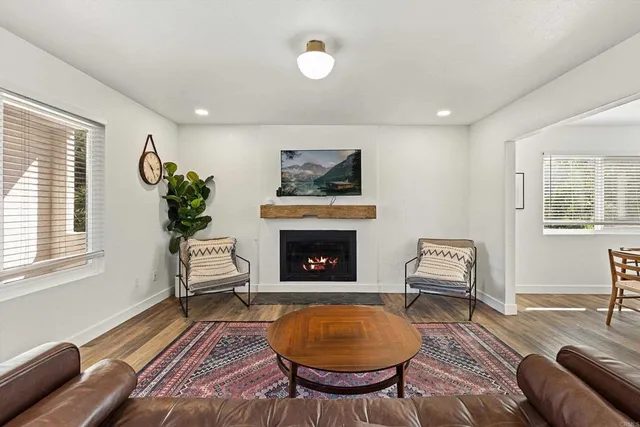 a dining room with furniture and window