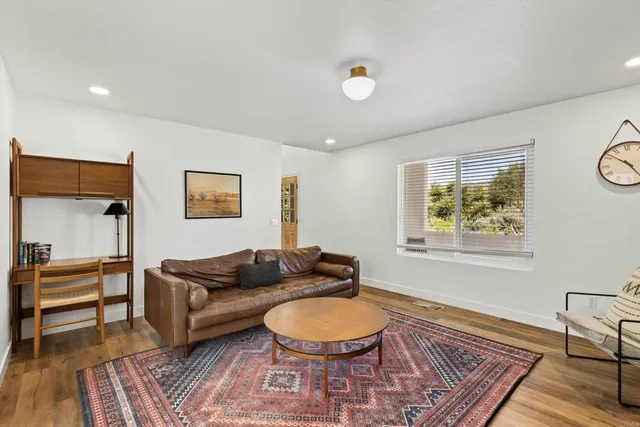 a view of a dining room with furniture and chandelier