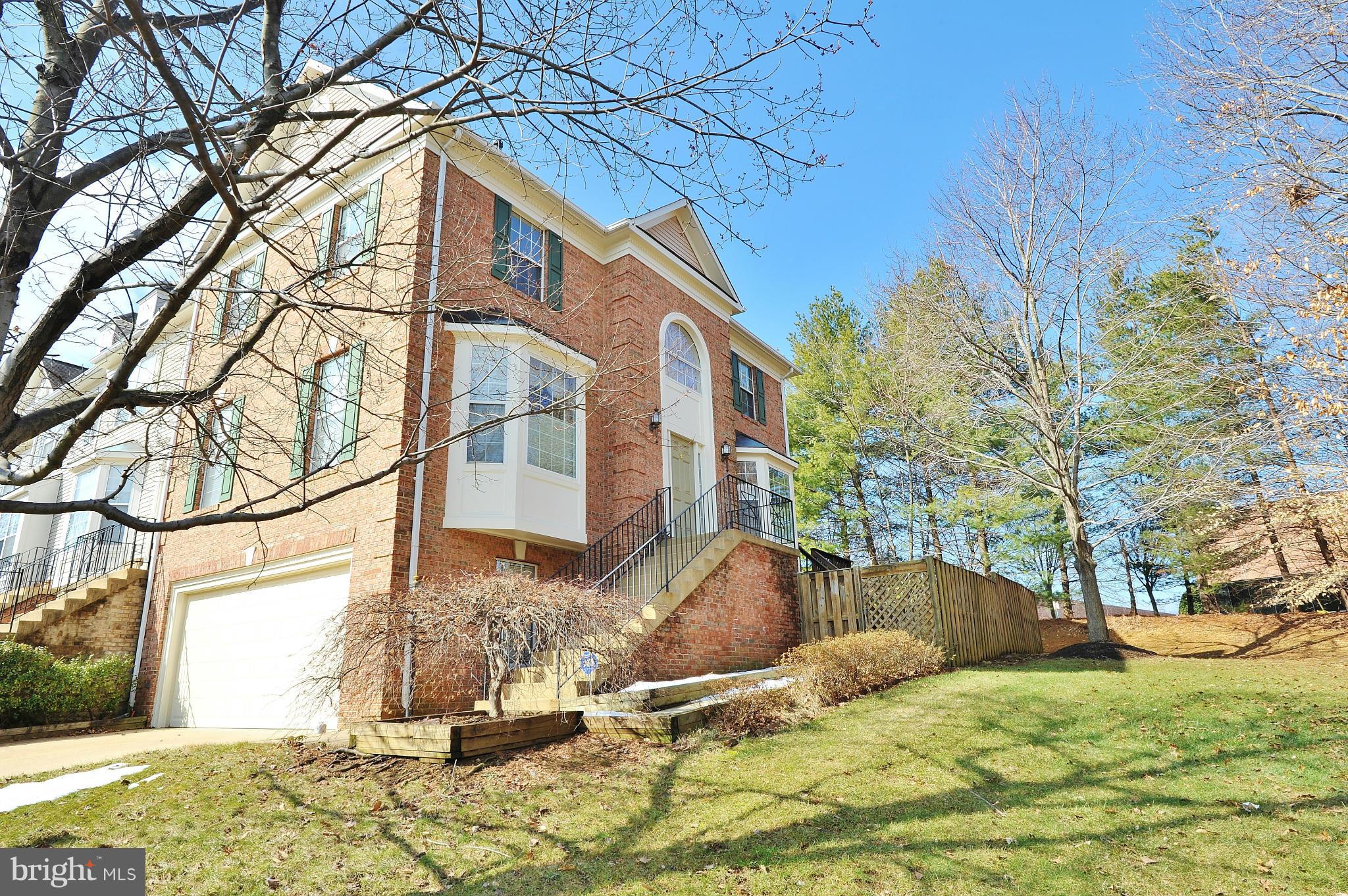 5700 Clapham Road Alexandria, VA 22315 - Photo 1 of 30 a backyard of a house with table and chairs