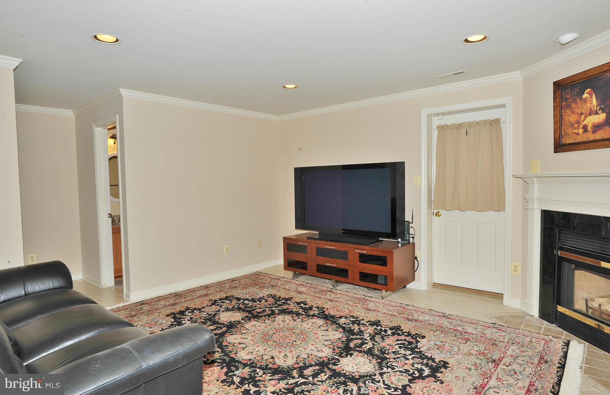 5700 Clapham Road Alexandria, VA 22315 - Photo 15 of 30 a living room with furniture and a flat screen tv