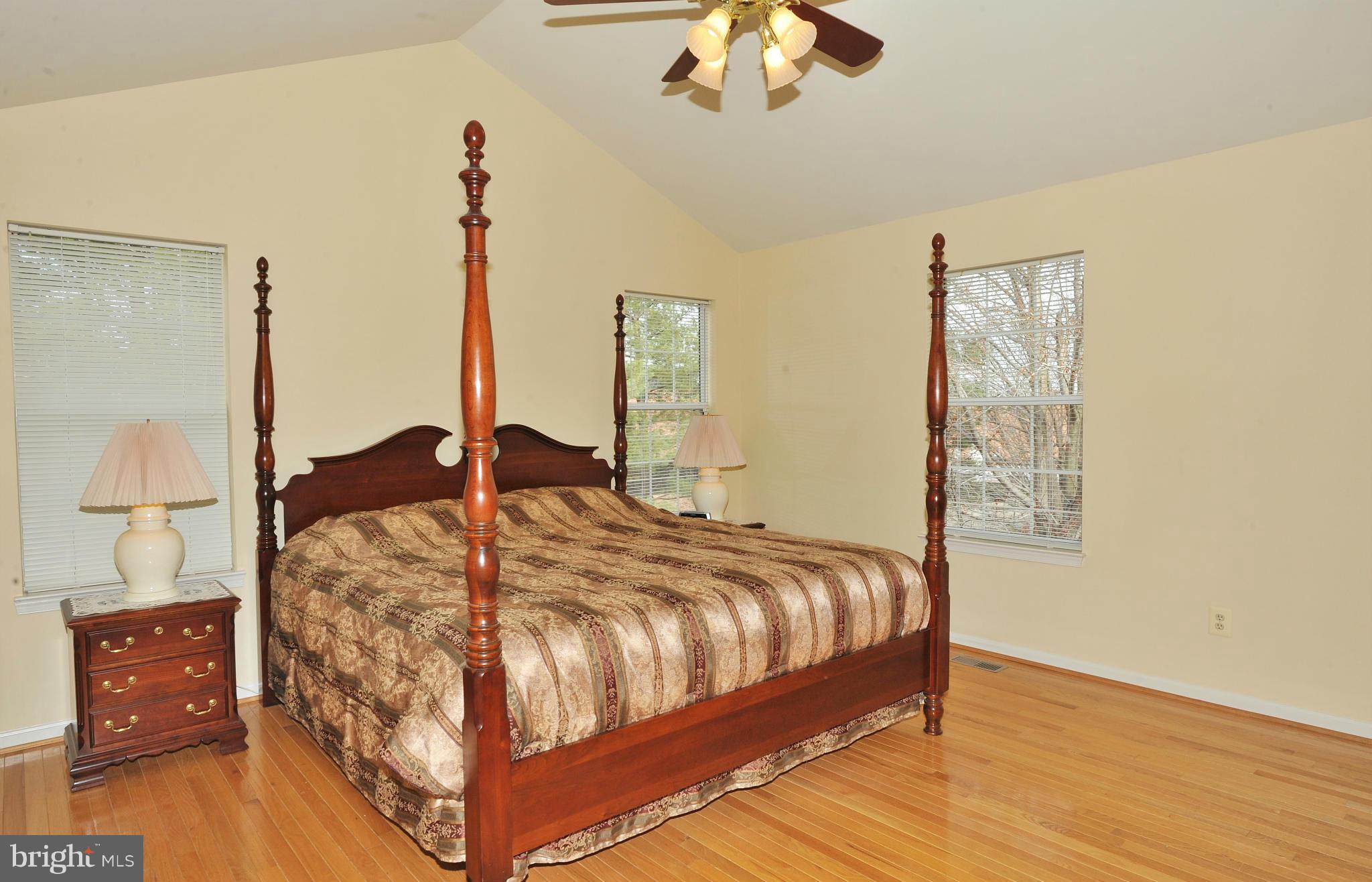 5700 Clapham Road Alexandria, VA 22315 - Photo 19 of 30 a bed sitting in a bedroom next to a window