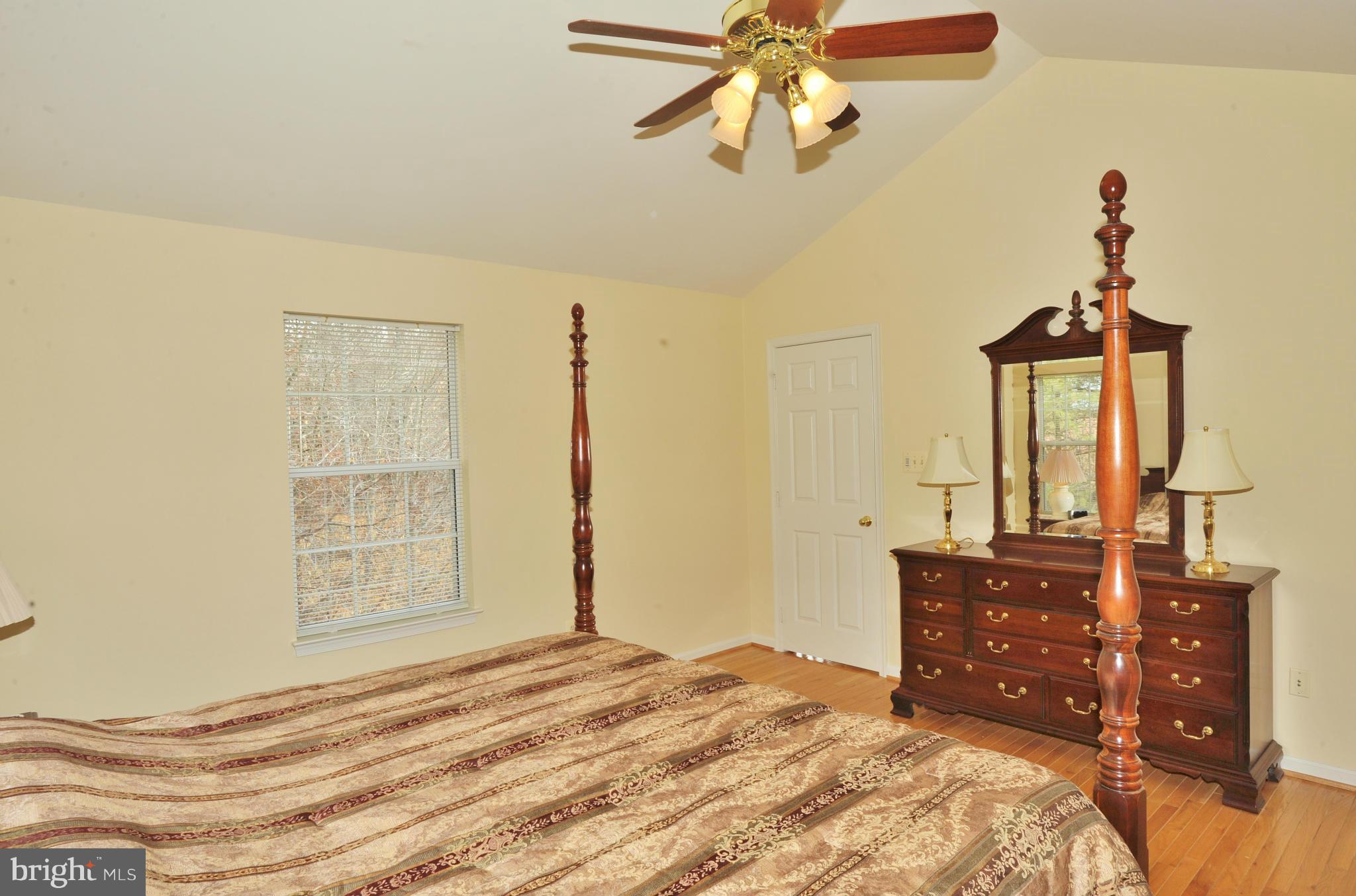 5700 Clapham Road Alexandria, VA 22315 - Photo 21 of 30 a bedroom with a bed and a dresser