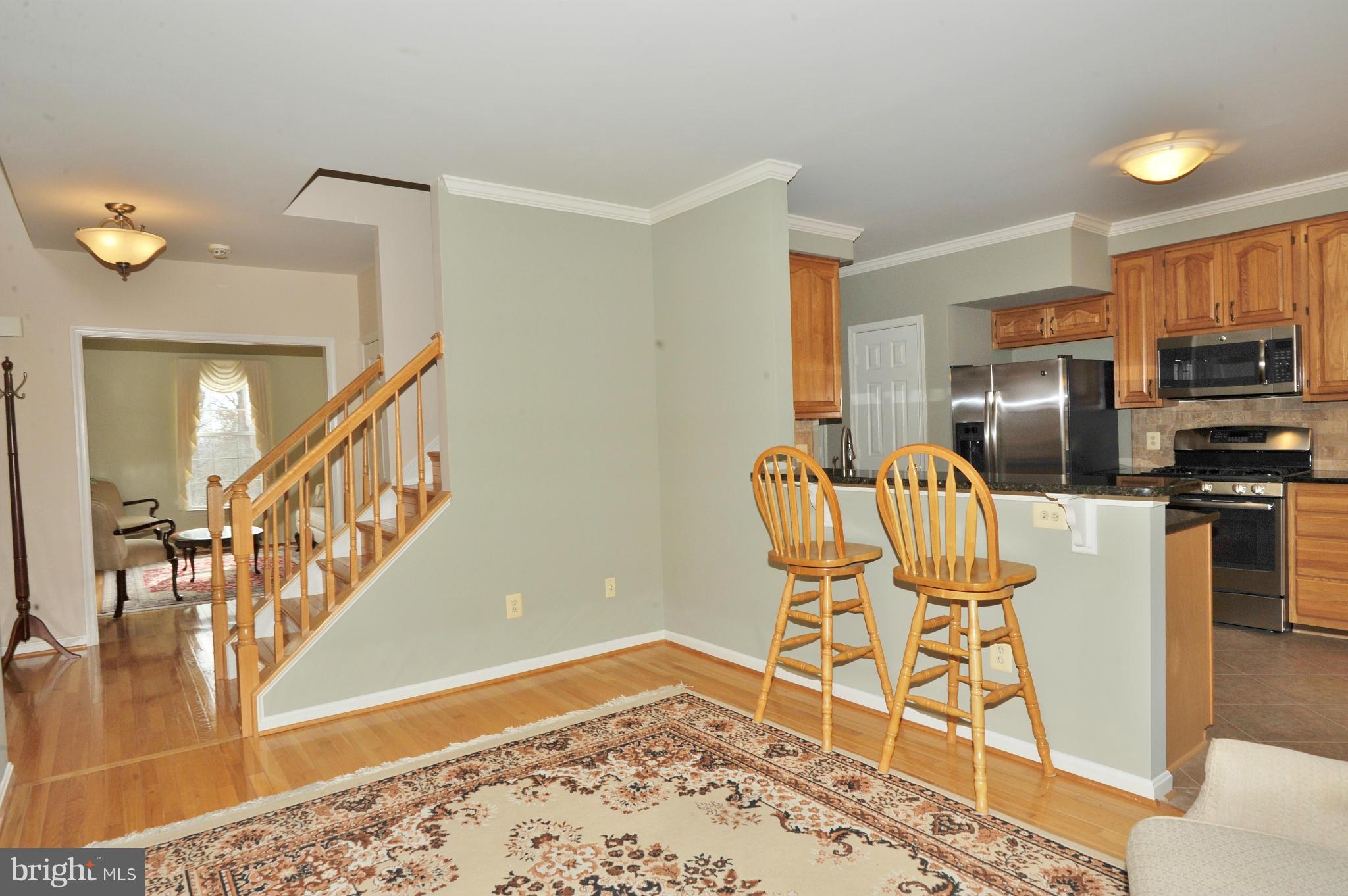 5700 Clapham Road Alexandria, VA 22315 - Photo 6 of 30 a workspace room with furniture and wooden floor