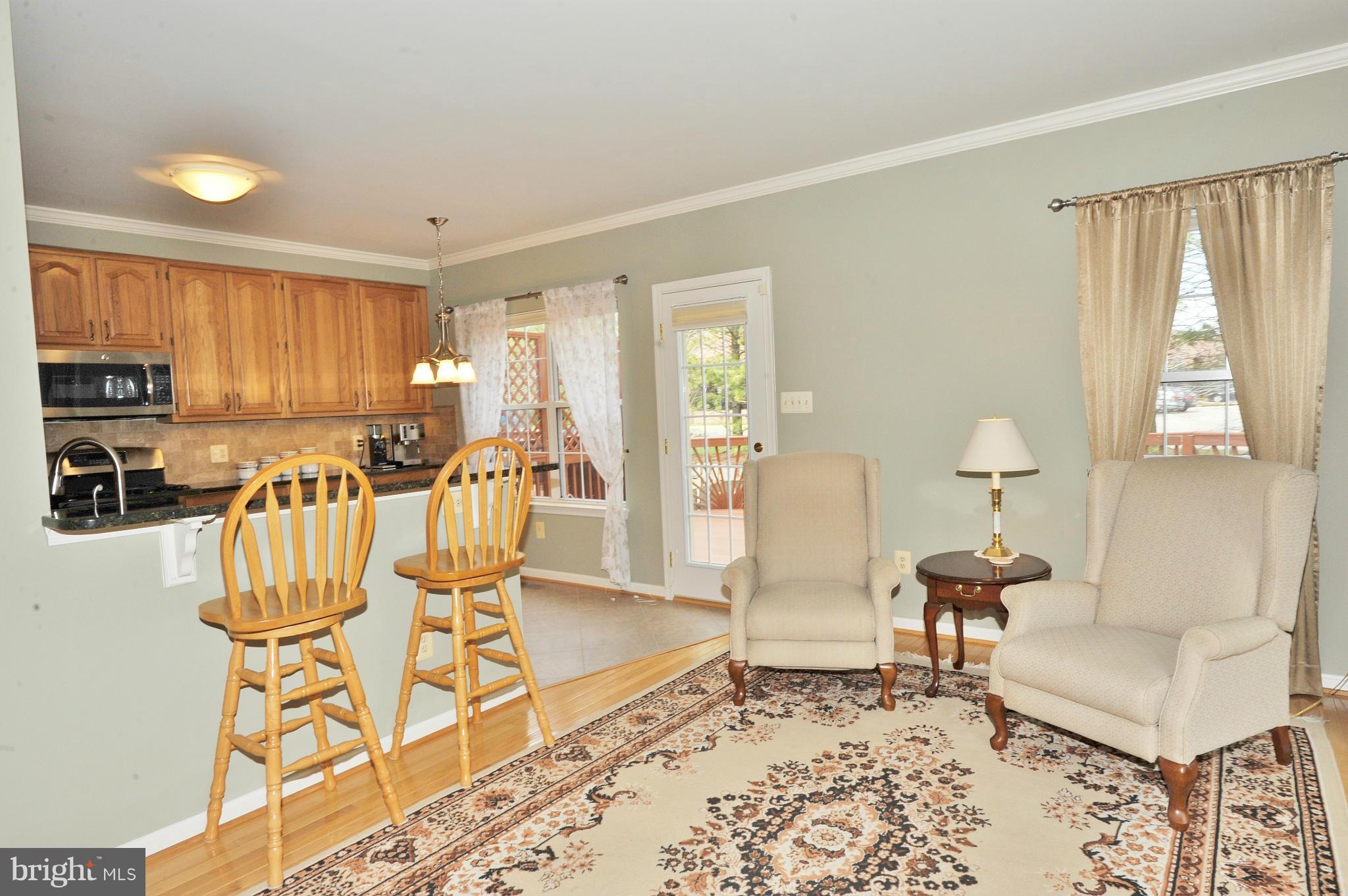 5700 Clapham Road Alexandria, VA 22315 - Photo 7 of 30 a living room with furniture and a large window