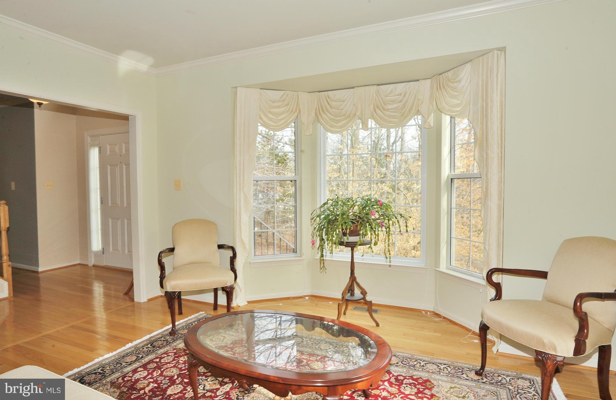 5700 Clapham Road Alexandria, VA 22315 - Photo 10 of 30 a living room with furniture and a window