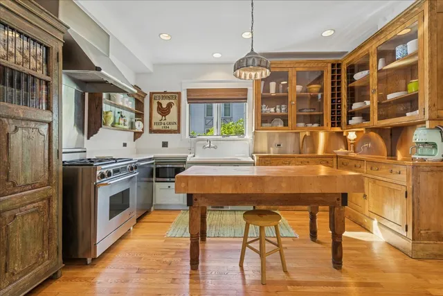 a kitchen with stainless steel appliances granite countertop a stove and a refrigerator