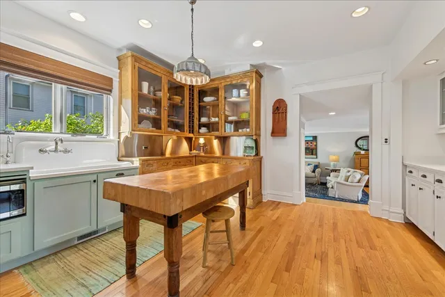 a living room with furniture a table and a large window