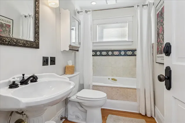 a spacious bathroom with a tub and shower