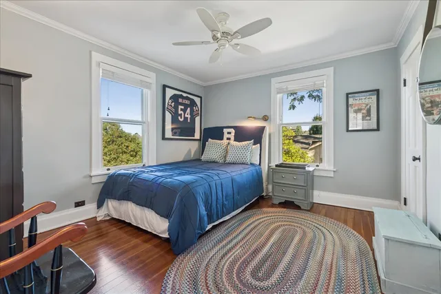 a bed room with a bed and dresser