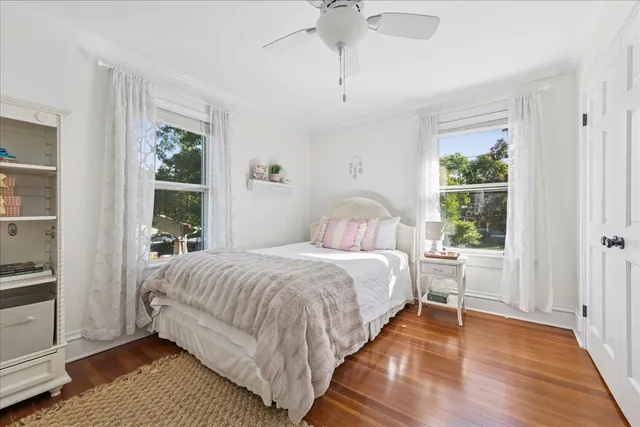 a bedroom with furniture and a window